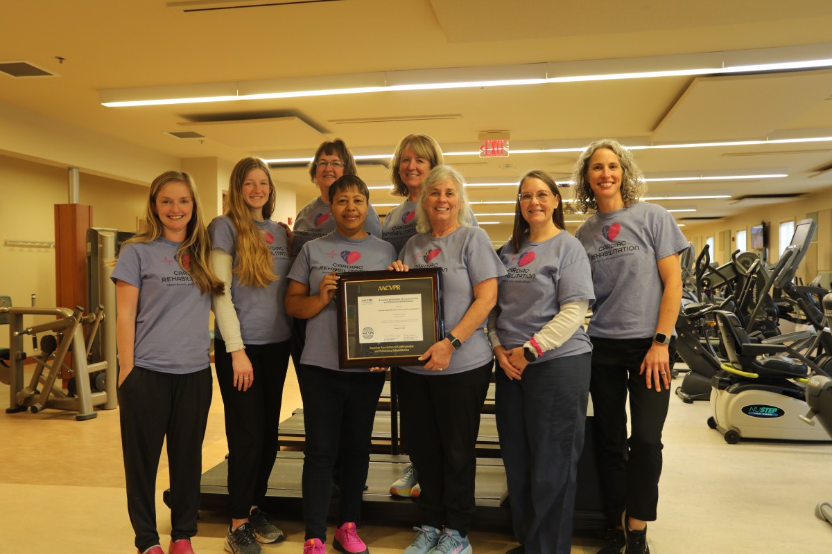 Valarie Washington and Linda Costello hold the AACVPR certification in the group photo of the Fauquier Health Cardiac Rehab team.